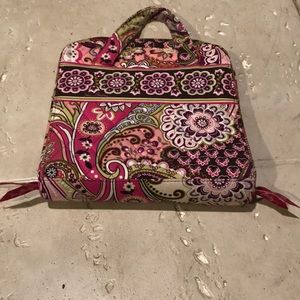 A Vera Bradley travel bag.